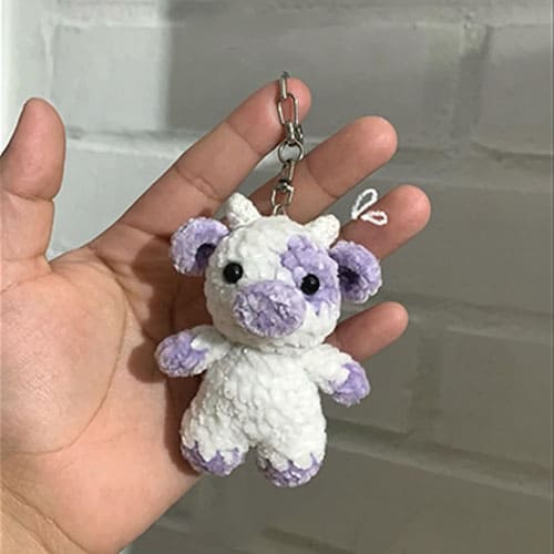 Free purple crochet amigurumi cow keychain pattern